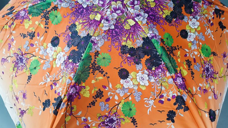 parapluie de poche Jean Paul Gaultier micro plat orange fleurs pochon imperméable, léger et solide