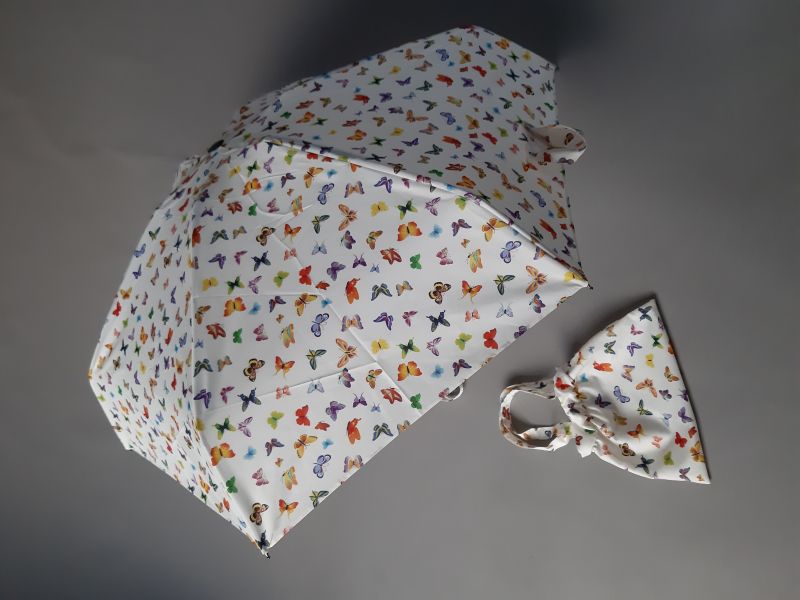 Parapluie avec un sac imperméable, un mini plat pliant blanc à motif papillons multicolores Guy de Jean, léger et solide