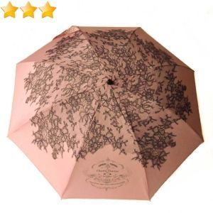 Parapluie Chantal Thomass de luxe pliant rose sur un motif à dentelle noire, chic & anti vent