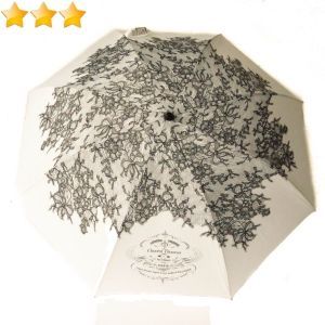 Parapluie Chantal Thomass de luxe pliant blanc à dentelle noire, élégant et robuste