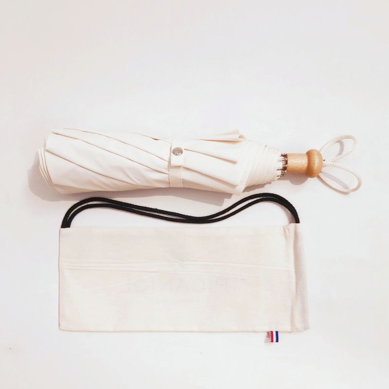 EXCLUSIVITE : Ombrelle anti uv 100% pliante doublée en coton uni ivoire sa poignée bois français, légère & anti vent