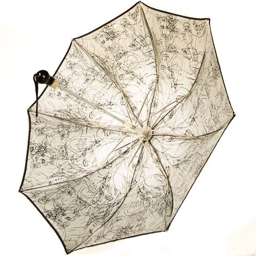 Parapluie JP Gaultier pliant automatique noir doublé argent avec un motif de visages et silhouette par Cocteau, pliant et robuste